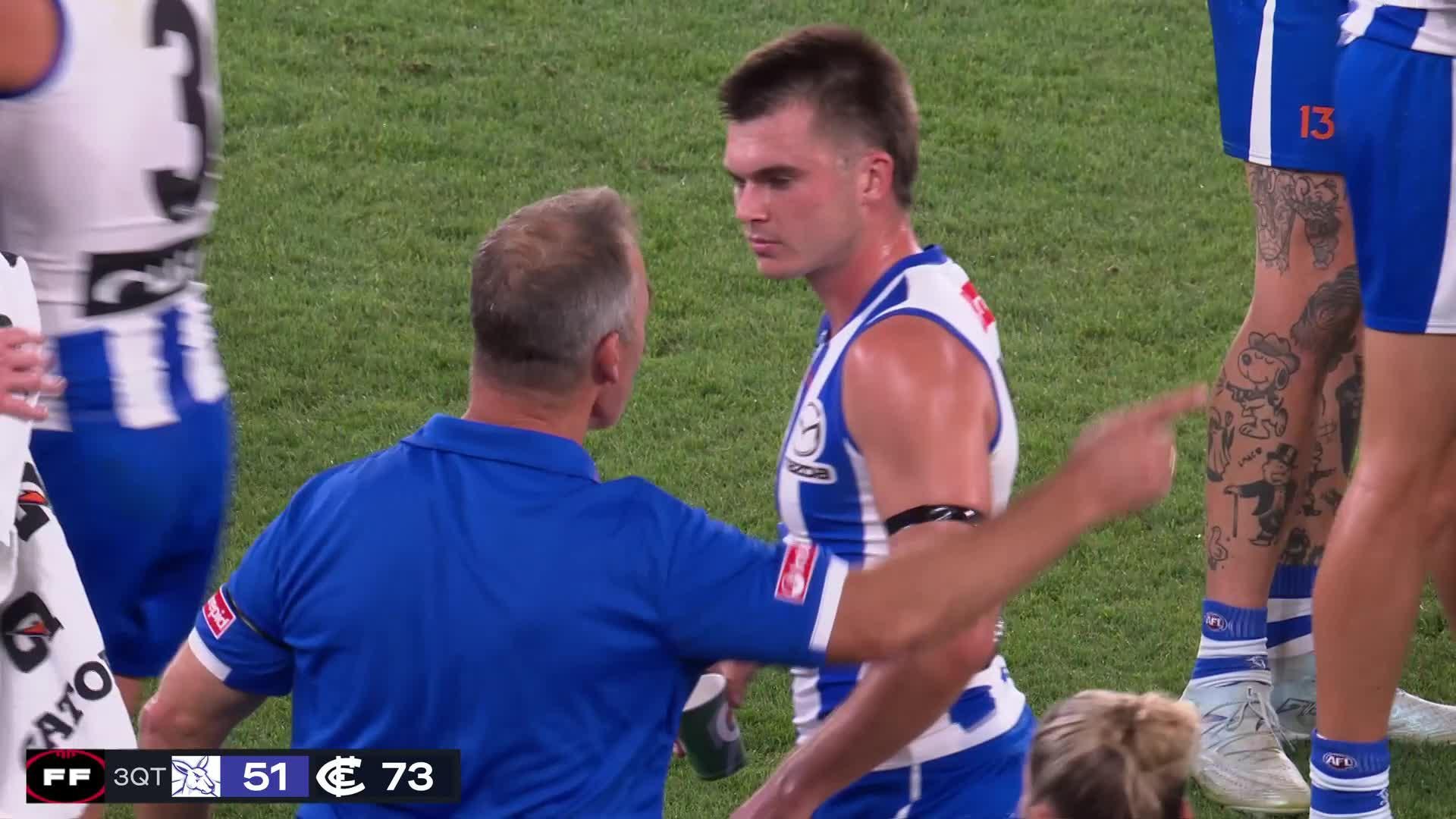 Clarkson coaching from the bench during AFL game