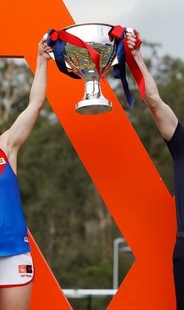 Daisy Pearce and Mick Stinear lift the premiership cup after Melbourne's win over Brisbane in the S7 Grand Final on November 27, 2022. Picture: AFL Photos