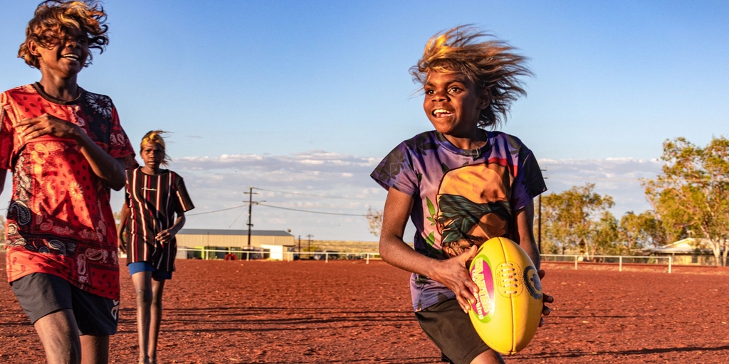 Behind the Lens: The 'pure love and joy' of footy in the remote red desert - Vimarsana News