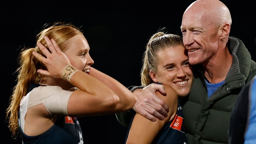 Sophie (left) and Abbie McKay with father Andrew after Carlton's AFLW semi-final win over Hawthorn on November 15, 2025. Picture: AFL Photos