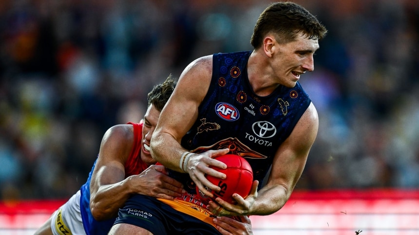 Mark Keane is tackled by Jake Melksham during the match between Adelaide and Melbourne at Adelaide Oval in round 17, 2025. Picture: Getty Images