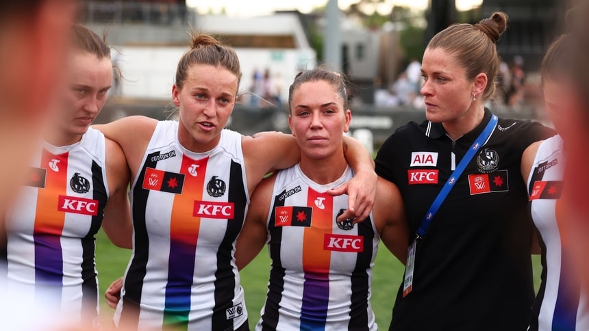 Bri Davey (right) watches on as Ruby Schleicher speaks to Collingwood players during round 10, 2025. Picture: AFL Photos/Getty Images