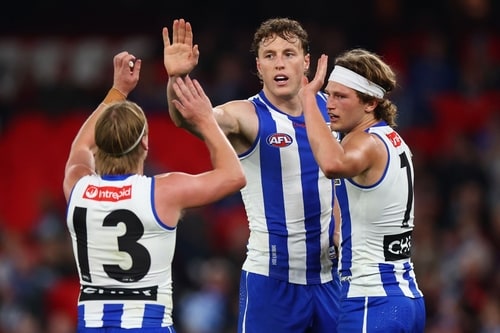 Nick Larkey celebrates a goal for North Melbourne against Essendon in Round 16, 2026