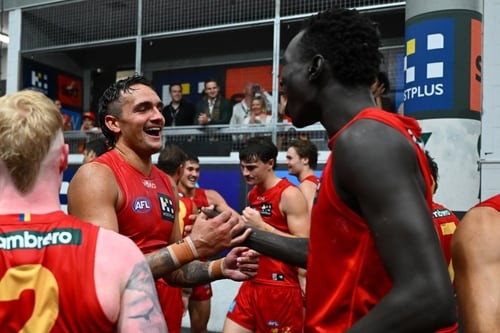 Jamarra Ugle-Hagan and Mac Andrew celebrating for Gold Coast
