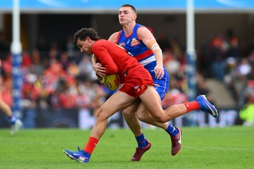 Cooper Hynes and Wil Powell compete for the ball