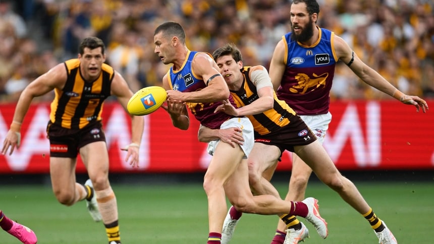 Will Day tackles Josh Dunkley during Hawthorn's preliminary final against Brisbane on September 19, 2026. Picture: Getty Images
