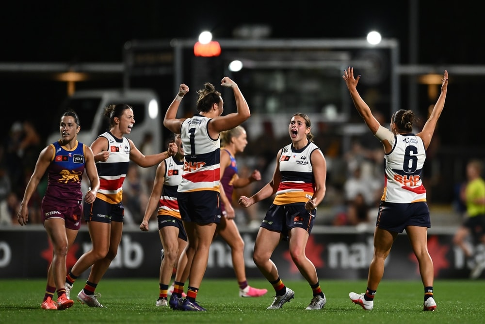Crows hold off arch-rival Lions in fiery finish