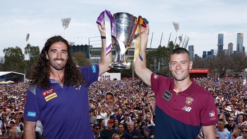Alex Pearce and Josh Dunkley hold the premiership cup aloft at the 2026 Toyota AFL Grand Final Parade. Picture: AFL Photos