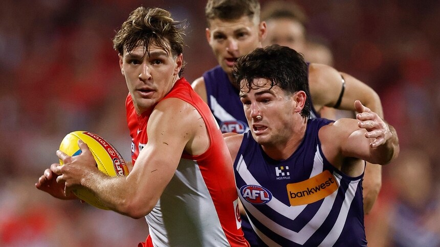 Errol Gulden is tackled by Andrew Brayshaw during the 2026 preliminary final between Sydney and Fremantle. Picture: AFL Photos